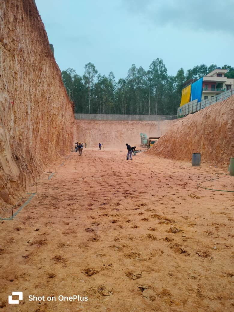 Anti-termite soil trench treatment along a foundation wall